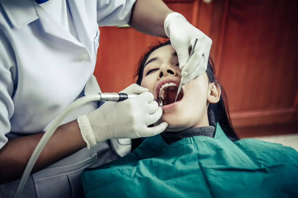 dentist treats patients teeth